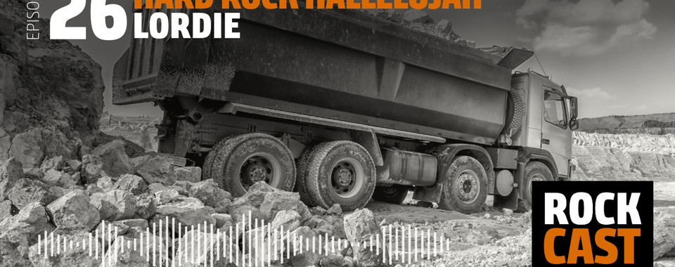 A truck loaded with stones at a quarry. Overlay text reads "Episode 26 Hard Rock Hallelujah."